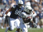 Portland State running back Za’Quan Summers (22) carries the ball as he is pursued by BYU defensive lineman Solomone Wolfgramm (99) in the second half during an NCAA college football game, Saturday, Aug. 26, 2017, in Provo, Utah.