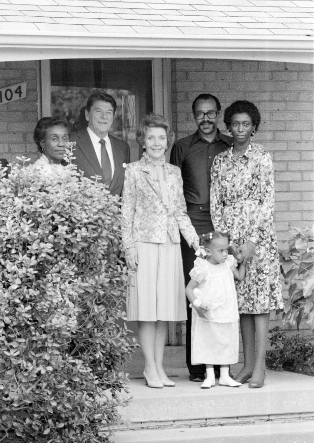 President Ronald Reagan and first lady Nancy Reagan stand with the Butler family on the front porch of the Butlers’ College Park, Md., home in 1982, five years after William Aitcheson, then a Ku Klux Klan “wizard,” burned a cross in the family’s lawn.