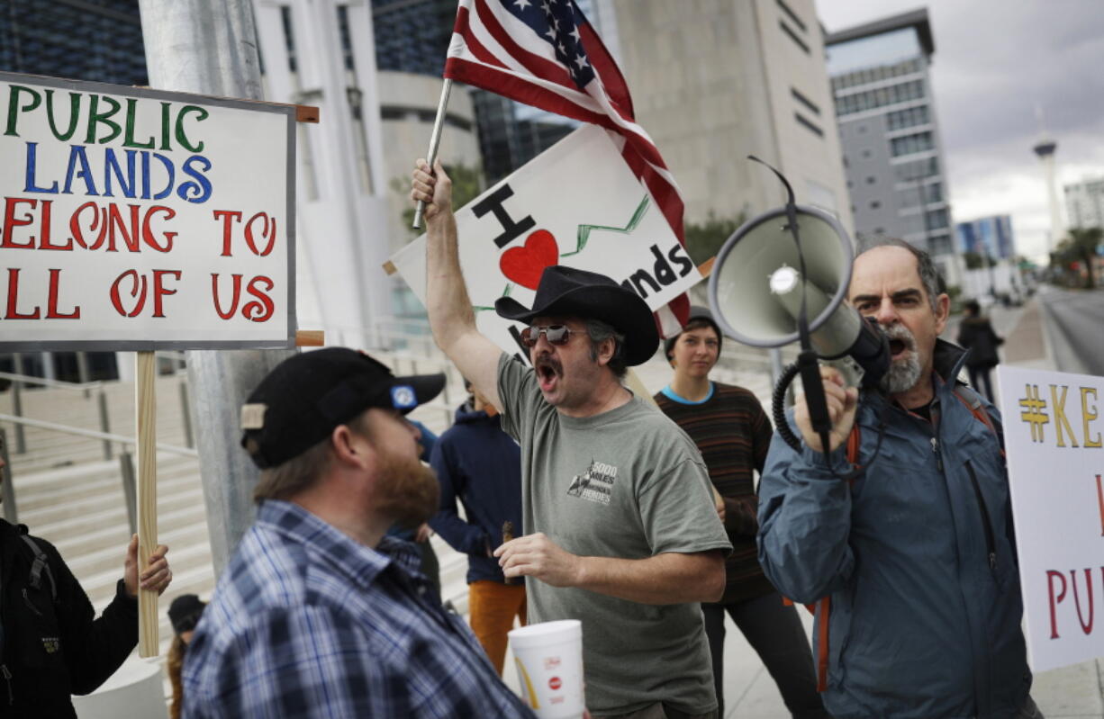 Supporters and critics of defendants on trial for charges relating to a 2014 ranch standoff at the federal courthouse gather in Las Vegas. A federal jury in Las Vegas is deliberating again in the retrial of four men accused of wielding assault weapons against federal agents in a 2014 standoff near the Nevada ranch of anti-government figure Cliven Bundy. Jurors returned to work Monday, Aug. 21, 2017, after spending a little more than two days last week going over five weeks of evidence in the case against four defendants.