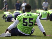 Seattle Seahawks defensive end Frank Clark (55) stretches during warmups before NFL football training camp, Monday, Aug. 7, 2017, in Renton, Wash. (AP Photo/Ted S.