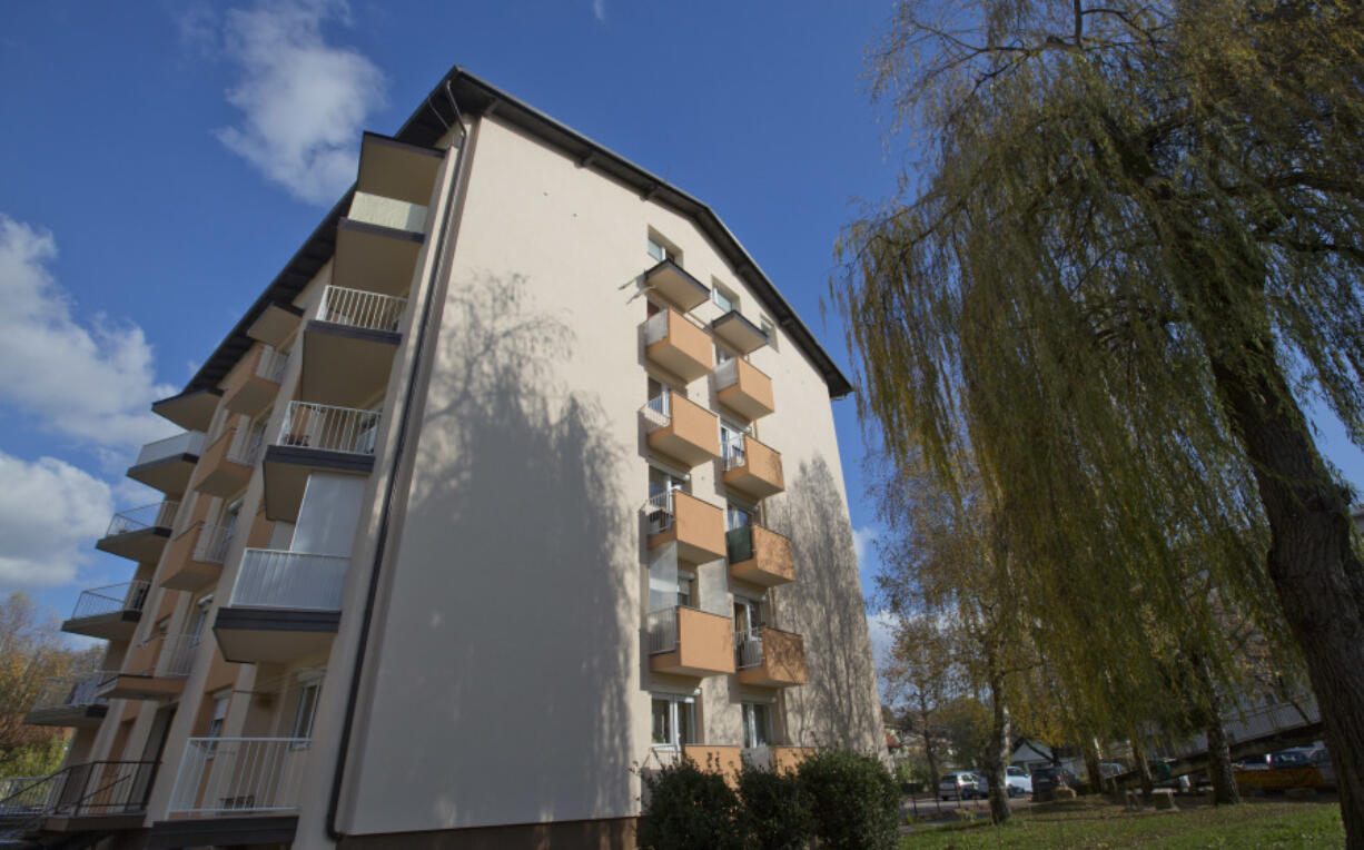 FILE - This Wednesday, Nov. 9, 2016 file photo shows the apartment building where U.S. first lady Melania Trump lived as a child in Sevnica, Slovenia. The tiny European nation of Slovenia is undergoing a tourism boom partly because it’s the native country of Melania Trump.