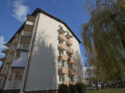 FILE - This Wednesday, Nov. 9, 2016 file photo shows the apartment building where U.S. first lady Melania Trump lived as a child in Sevnica, Slovenia. The tiny European nation of Slovenia is undergoing a tourism boom partly because it’s the native country of Melania Trump.