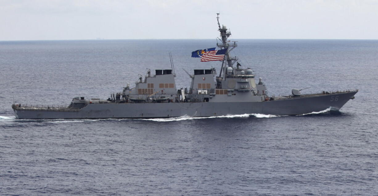 The USS John S. McCain (DDG-56) destroyer sails off the coast of Vietnam. A Navy official says the USS John S. McCain has sailed close to a Chinese man-made island in a freedom of navigation operation in the disputed South China Sea.