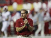 FILE - In this Dec. 3, 2016, file photo, Alabama coach Nick Saban watches his team warm up for the Southeastern Conference championship NCAA college football game between Alabama and Florida in Atlanta. Alabama has the No. 1 spot in The Associated Press' preseason media poll. Saban's Tide has become the surest thing in sports these days. They don't always win the national championship -- just half the time over the last eight years–but they are always in contention. Since 2008, only once has the Tide lost more than one game before bowl season.