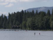 Paddle boarders ply the waters of Lake Tahoe near Tahoe City, Calif., on Aug. 8. Lake Tahoe’s known for summer and winter fun, but there’s a third side to Tahoe: fall, when crowds thin out, rates are cheaper and trees put on a show.