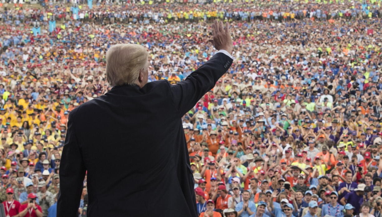 President Donald Trump waves to the crowd after speaking at the 2017 National Scout Jamboree last month in Glen Jean, W.Va. The Boy Scouts are denying a claim by President Donald Trump that the head of the youth organization called the president to praise his politically aggressive speech to the Scouts’ national jamboree.