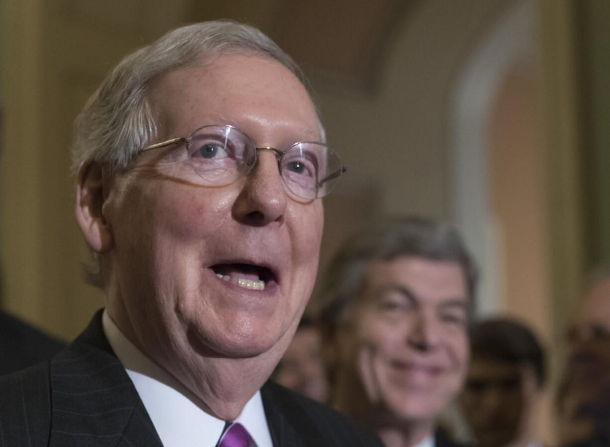 FILE - In this Aug. 1, 2017 file photo, Senate Majority Leader Mitch McConnell of Ky. meets with reporters on Capitol Hill Washington. Congressional aides say President Donald Trump will meet House and Senate leaders at the White House next week, as lawmakers return from an August break and plunge into a daunting pile of work. (AP Photo/J.