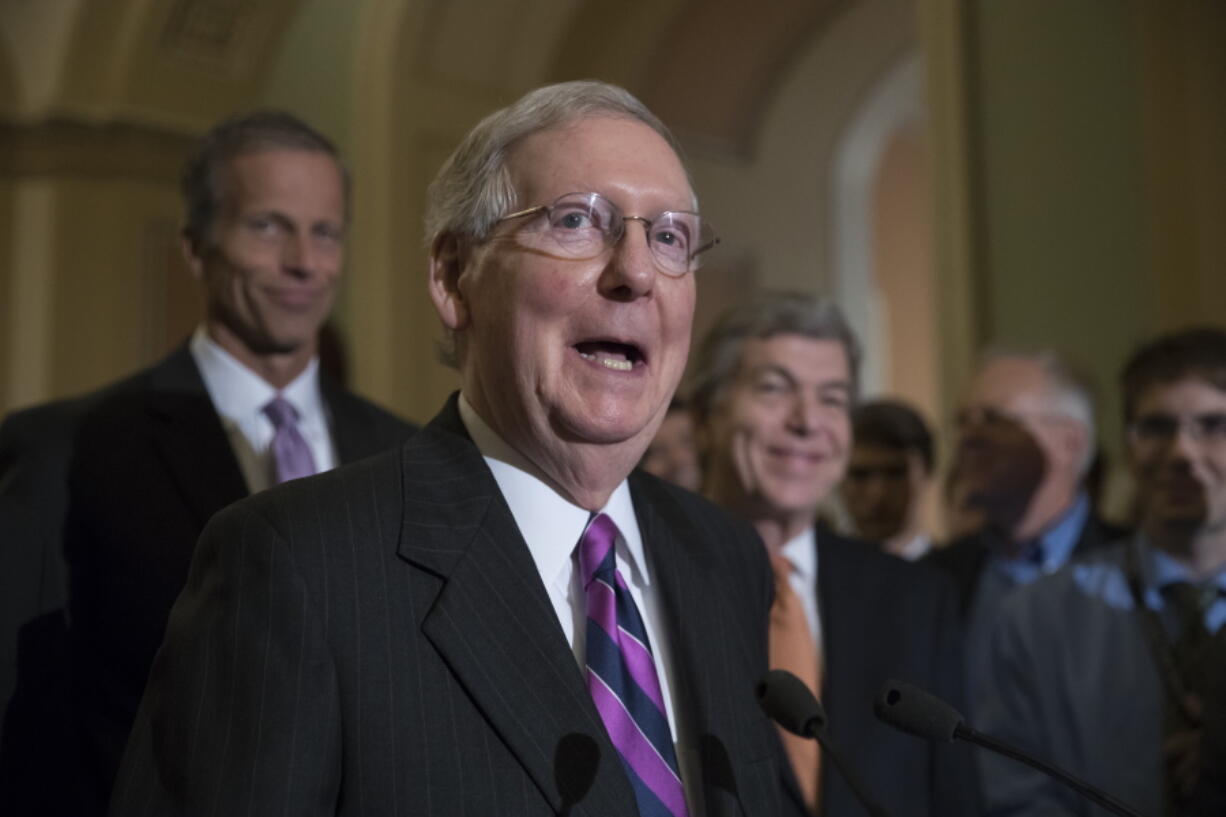 Senate Majority Leader Mitch McConnell of Ky. speaks on Capitol Hill Washington. McConnell is condemning the “messages of hate and bigotry” carried by the KKK and white supremacist groups. (AP Photo/J.