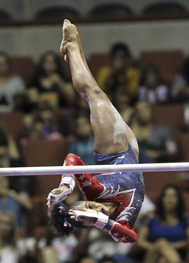 Jordan Chiles competes on the uneven parallel bars during the women's U.S. gymnastics championships, Sunday, Aug. 20, 2017, in Anaheim, Calif. (AP Photo/Ringo H.W.