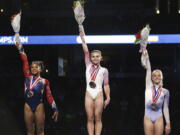 Ragan Smith, center, waves to fans along with Jordan Chiles, left, and Riley McCusker after winning the women’s all-around at the U.S. gymnastics championships, Sunday, Aug. 20, 2017, in Anaheim, Calif. (AP Photo/Ringo H.W.