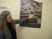 Mary Rose explains that Lev Richards took an aerial photo of a 1942 shipyard launch while leaning out of the airplane he was piloting. Rose will give a talk Aug. 21 about the history of eclipses in the Northwest.