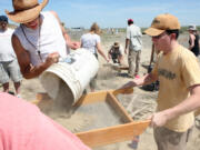 Kamiakin High School students get hands-on experience sifting through dirt at a mammoth excavation site southwest of Kennewick on May 17, 2008. Volunteers at the nearby Coyote Canyon Mammoth Site believe the creature whose bones were found on a hillside near Kennewick was a male.