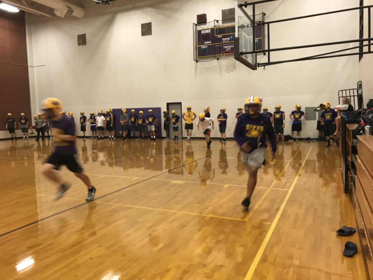 Columbia River players run through sprint drills in the gym Wednesday (Meg Wochnick/The Columbian)