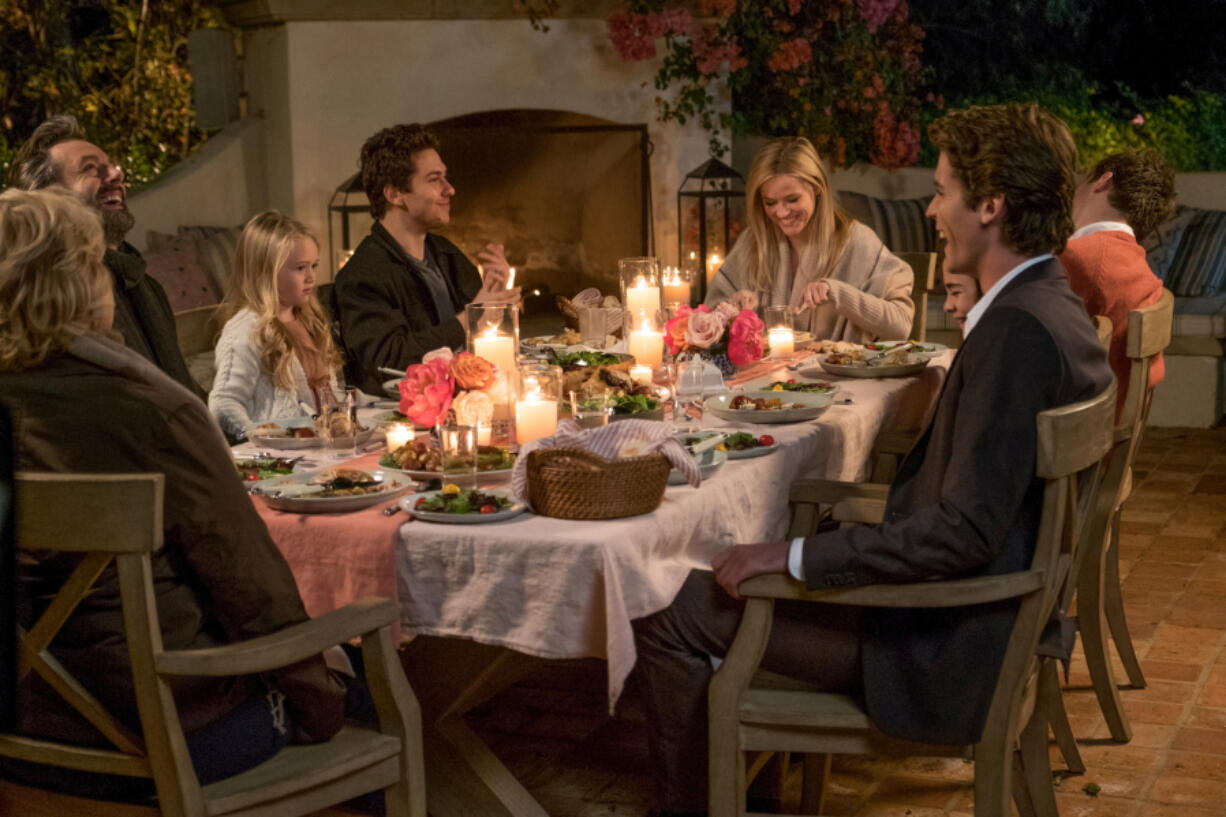 Candice Bergen, clockwise from left, Michael Sheen, Eden Grace Redfield, Nat Wolff, Reese Witherspoon, Jon Rudnitsky, Lola Flanery and Pico Alexander in “Home Again.” Karen Ballard/Open Road Films