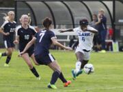 Clark's Facienne Graham (6) moves the ball past Clackamas' Zara Lindquist (7) during Saturday's afternoon soccer game at Clark College on Sept. 16, 2017. The Penguins won 5-0.