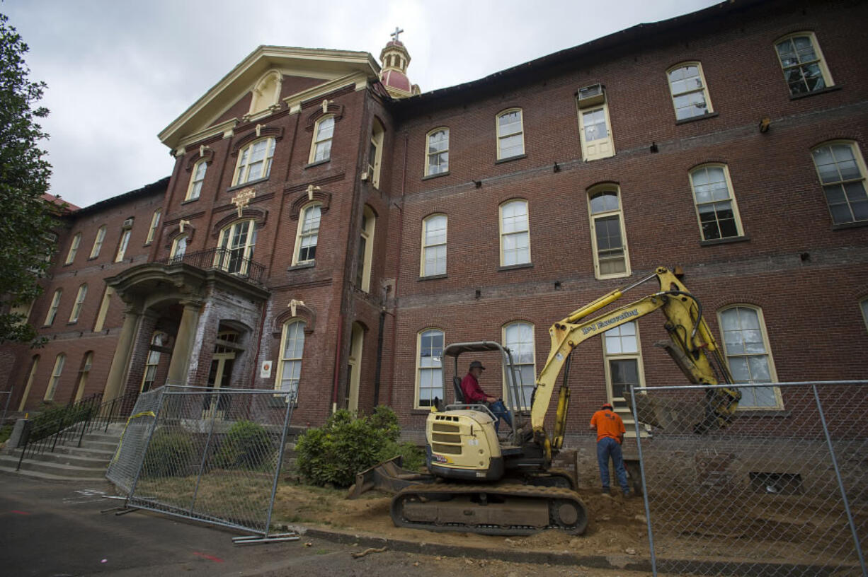 While contractors such as B & J Excavating renovate Providence Academy this summer, Washington State University Vancouver is developing an “augmented reality” experience so visitors can use mobile devices to take virtual tours and engage with historical figures at the Academy and along Officers Row.