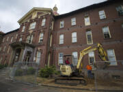 While contractors such as B & J Excavating renovate Providence Academy this summer, Washington State University Vancouver is developing an “augmented reality” experience so visitors can use mobile devices to take virtual tours and engage with historical figures at the Academy and along Officers Row.