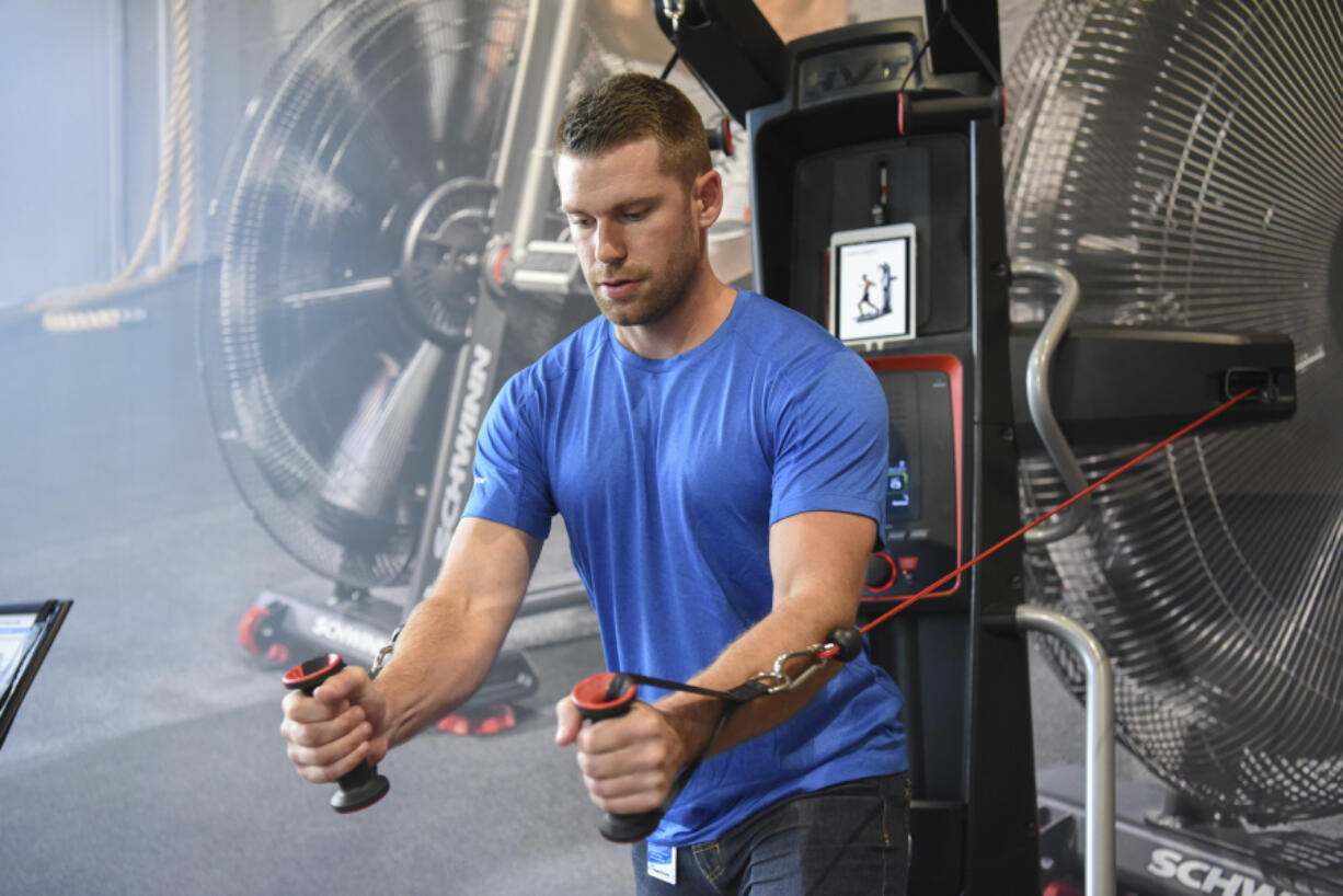 Gabriel Baker, a retail project manager at Nautilus Inc., demonstrates the Bowflex Hybrid Velocity Trainer at its Innovation Center in Vancouver. The company says new product innovation will be its foundation.