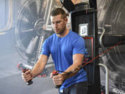 Gabriel Baker, a retail project manager at Nautilus Inc., demonstrates the Bowflex Hybrid Velocity Trainer at its Innovation Center in Vancouver. The company says new product innovation will be its foundation.