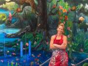 Camas: Local artist Elida Field puts the finishing touches on a jungle-themed mural at Prune Hill Elementary School combining the works of Field, artist Elsa Harris and students at the school.