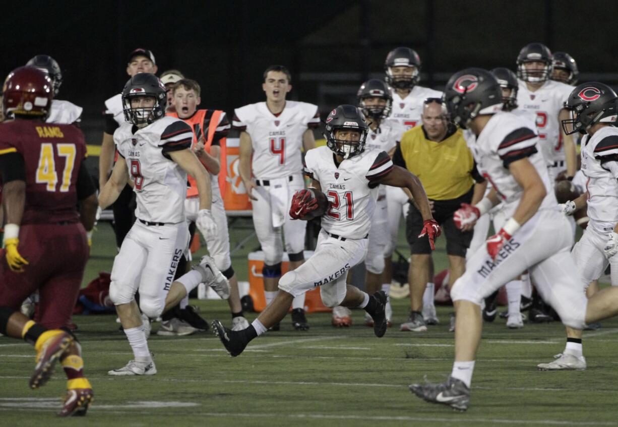 Camas wide receiver Drake Owen (21) makes a cut on a punt return vs. Central Catholic at Hillsboro Stadium.