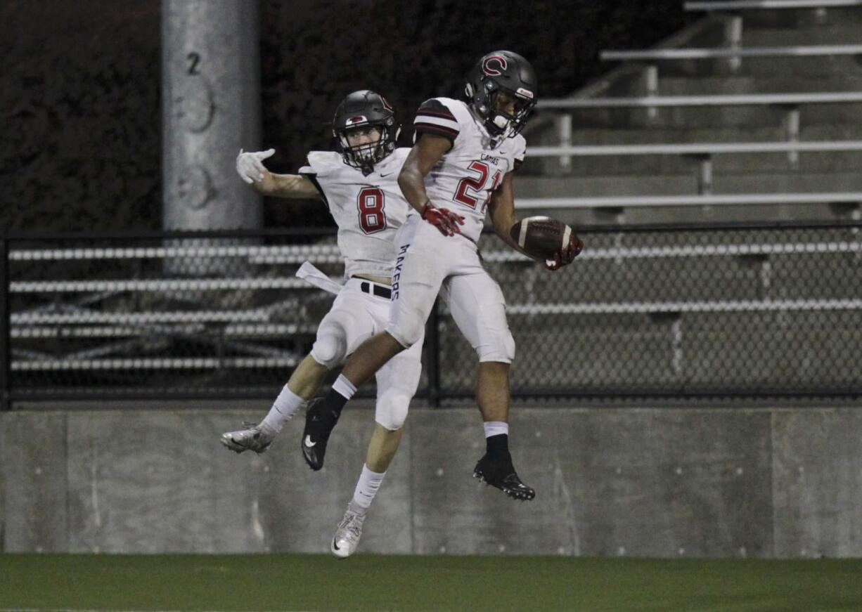 Camas players Ryan Rushall (8) and Drake Owen (21) celebrate a touchdown vs. Central Catholic at Hillsboro Stadium.