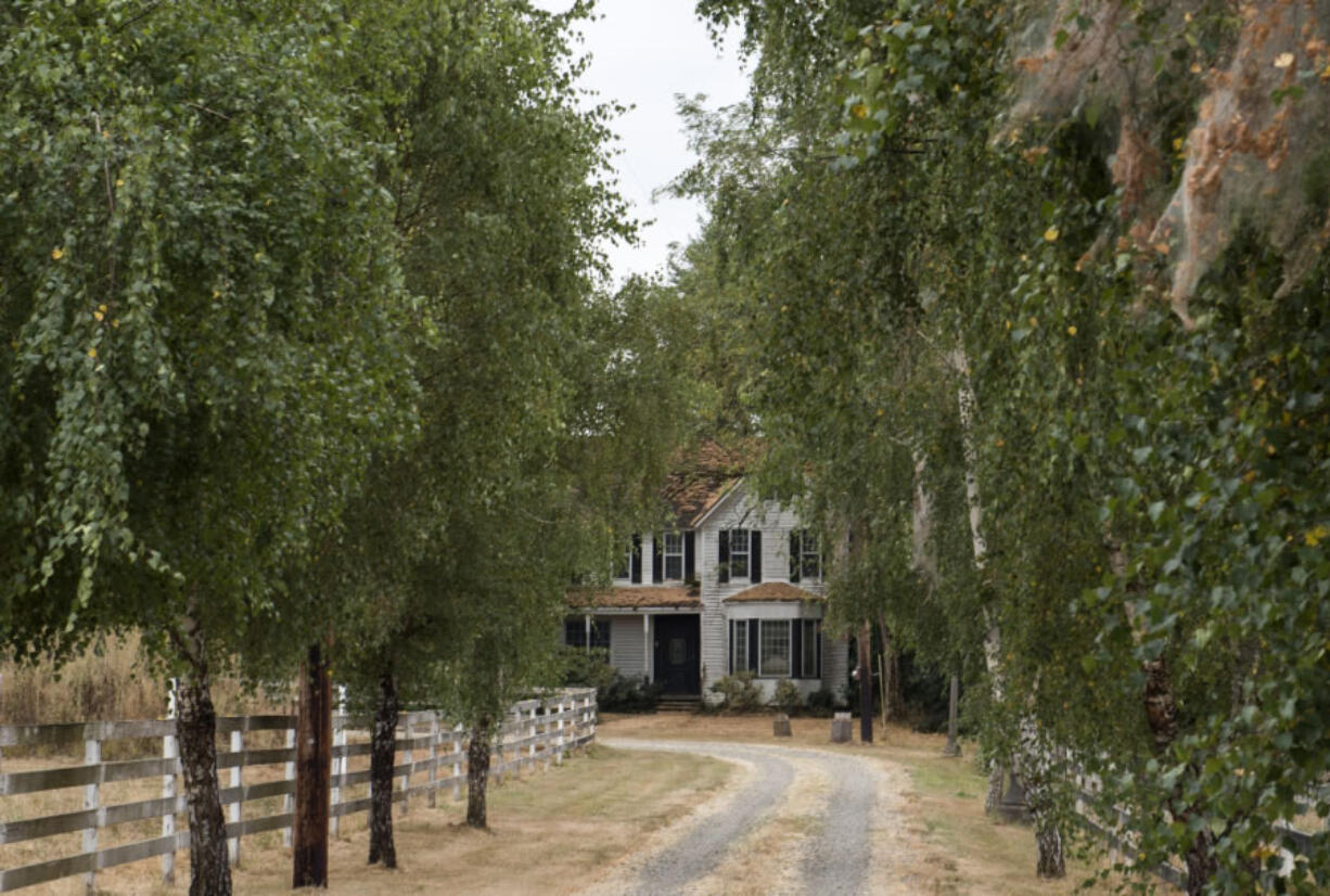 Owners of an 1889 La Center home, Marsha and Lloyd Lytton, say they want to give the house away. The new owners will have to find a way to move it off the property.