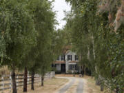 Owners of an 1889 La Center home, Marsha and Lloyd Lytton, say they want to give the house away. The new owners will have to find a way to move it off the property.