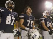 Storm Levi Hoppes (79) amps up his teammates during the Friday night football ball game at Kiggins Bowl between Skyview High School and Eastside Catholic School on Sept. 8, 2017.