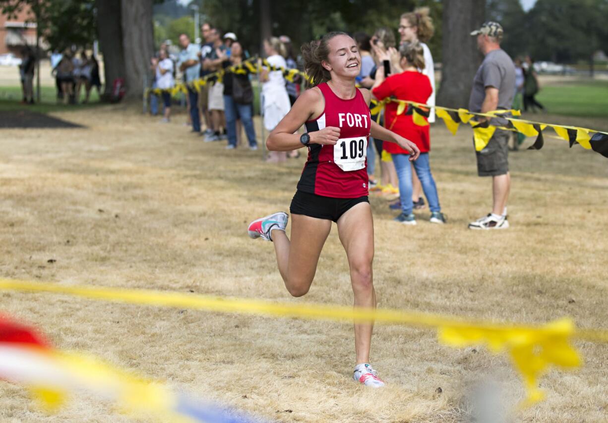 Fort Vancouver junior Emily Phelps (109) crosses the finish line with her eyes closed and a smile on her face in first place in the annual Run-A-Ree for varsity women's with a time of 18 minutes, 51 seconds at Hudson's Bay High School in Vancouver on Friday, Sept. 8, 2017.