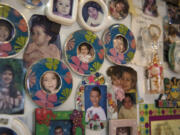 Photos of Enedis and Ramon Flores-Garcia’s children from over the years cover their refrigerator door at the family’s Vancouver residence.