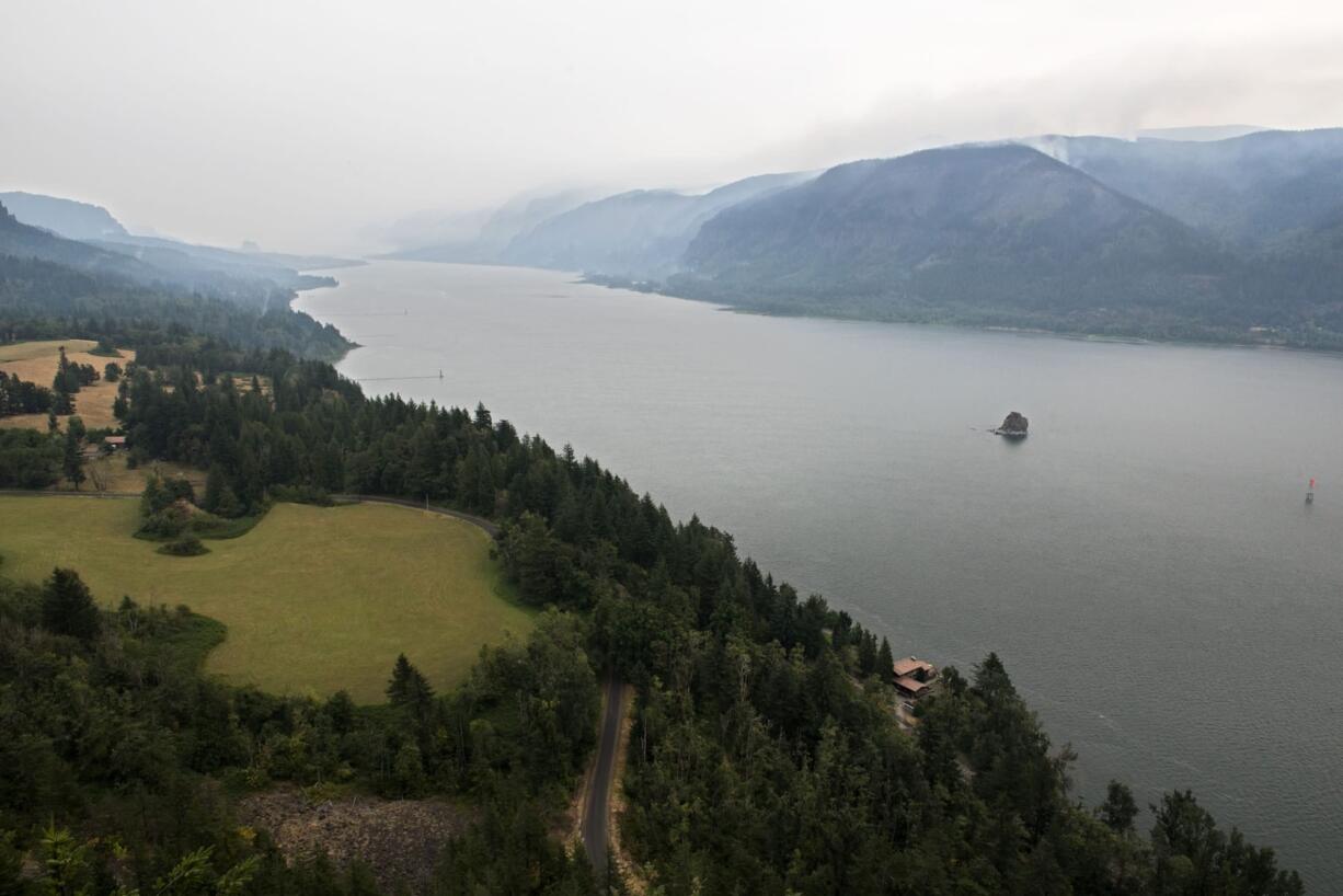 A view across the Columbia River from Cape Horn overlook off of Highway 14 on Thursday afternoon as firefighters continue to work the Eagle Creek Fire. Commercial shipping traffic on the river was interrupted this week by the fire.