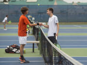 Battle Ground’s Gunnar Harlan, left, and Skyview’s Andrew Kabacy, right, shake hands after their match at Skyview High School on Monday afternoon, Sept. 25, 2017.