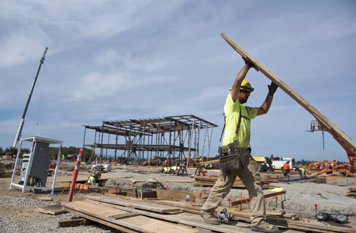 Anchor Concrete carpenter Aaron Ragsdale works at the construction site for Ridgefield School District’s new middle school campus. Construction is one of the fastest-growing industries in Clark County where incomes are on the rise.