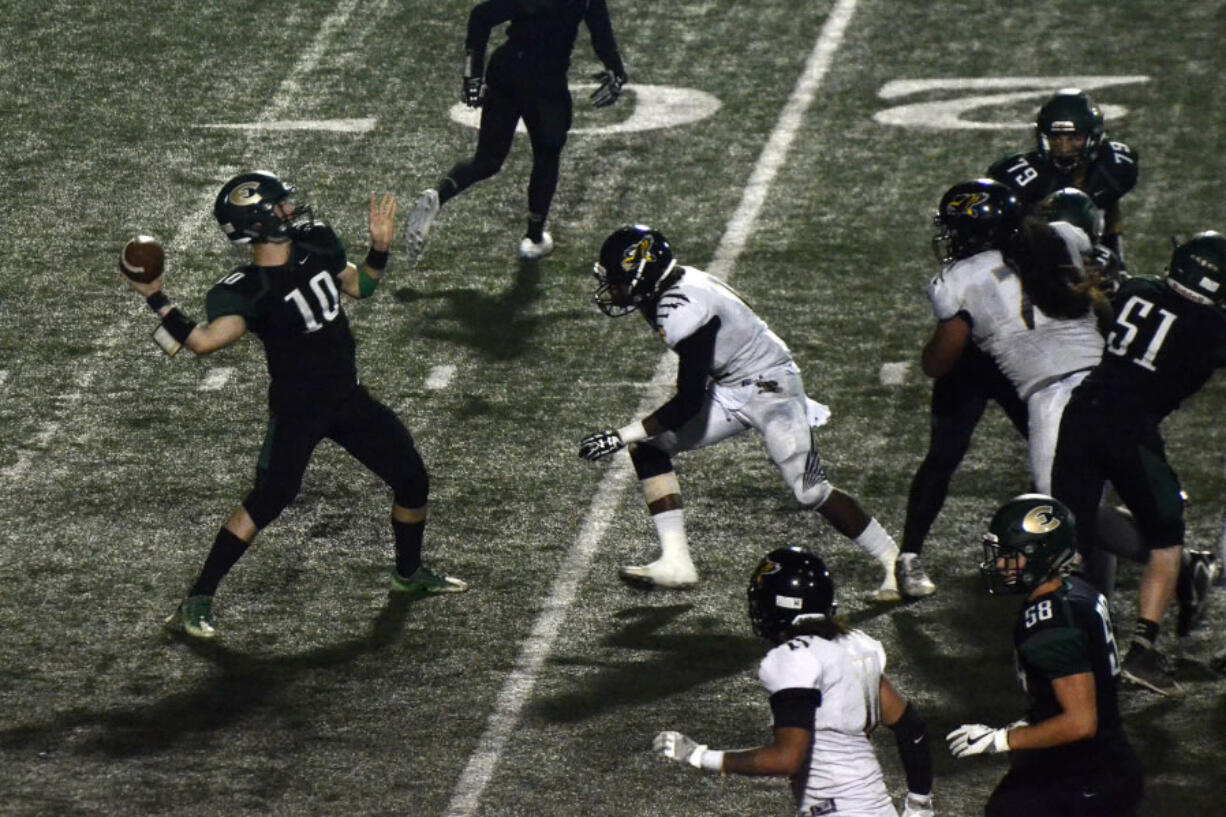 Evergreen quarterback Triston Fich looks for a deep receiver against Hudson's Bat at McKenzie Stadium on Friday, September 15, 2017.