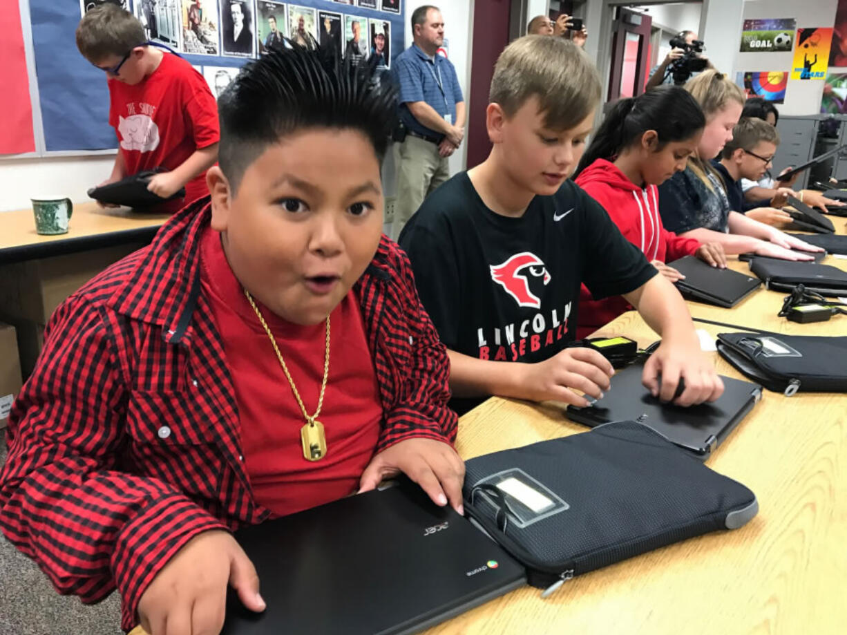 Battle Ground: Frontier Middle School sixth-graders were excited to receive their Chromebooks earlier this school. Evergreen Public Schools will hand out more than 800 to students as part of a multiyear effort to bring current technology to students.