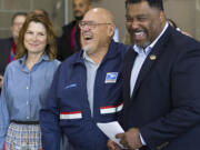 Postmaster of Ridgefield Carmen Arthur, left, Cody Hershaw, center, and Tyrone Williams, district manager of the East Vancouver Post Office, laugh during a ceremony honoring Hershaw for being named safest postal driver in the Western Area.