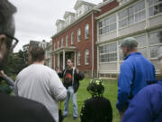 Jeff Davis talks about the history, mundane and otherwise, of the old hospital at the Fort Vancouver National Historic Site during a walking tour Sunday. The tour features ghost stories and history about the fort.