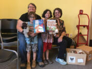 Suzanne Haidri, a teacher from Cascade Locks, Ore., and Jeanean Burgon, senior library assistant, with Cascade Locks siblings Lonnie and Luetta Bardes at the Stevenson evacuation shelter.