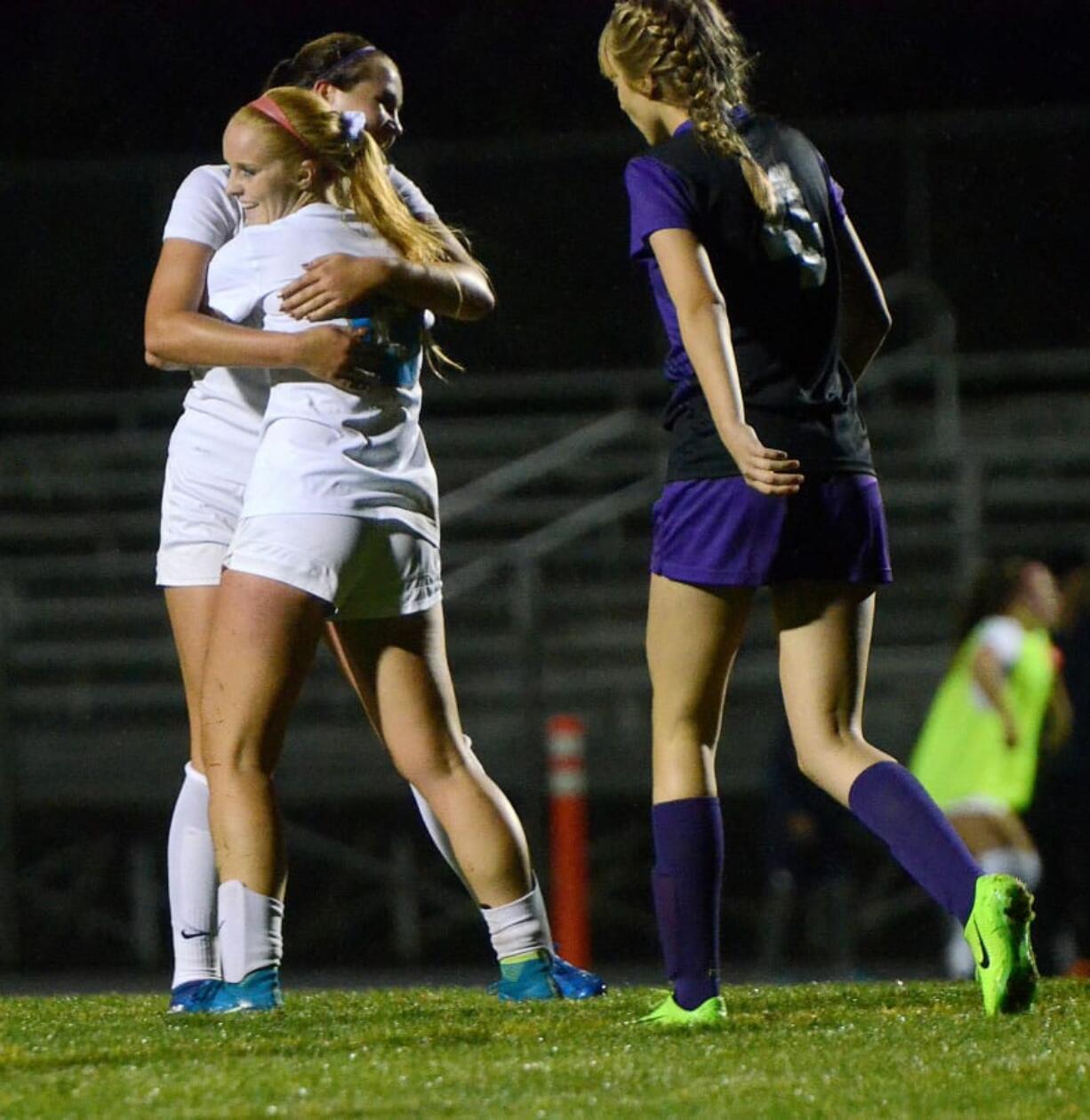 Hockinson seniors Kayla Sills and Trinity Paulsen hug after their game winning goal against Columbia River at Hockinson High School on Tuesday, September 19, 2017. Hockinson edged Columbia River 2-1.