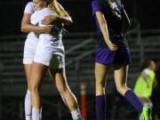 Hockinson seniors Kayla Sills and Trinity Paulsen hug after their game winning goal against Columbia River at Hockinson High School on Tuesday, September 19, 2017. Hockinson edged Columbia River 2-1.