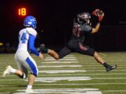 Camas receiver Drake Owen leaps for a reception against Coeur d’Alene at Doc Harris Stadium in Camas on Friday. Owen had two touchdown catches in the last 1:04, including the game-winner with 20 seconds left.