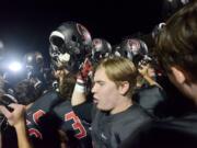 The Camas football team celebrates a close win against Coeur d'Alene at Doc Harris Stadium in Camas on Friday, September 22, 2017. Camas beat Coeur d'Alene 28-25.