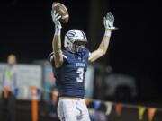 Skyview’s Cole Grossman (3) throws his arms in the air after making a touchdown against Mountain View during the second quarter at Kiggins Bowl in Vancouver, Friday September 22, 2017.