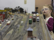 The model landscape, above, at the Southwest Washington Model Railroaders is almost at eye level with Carma Keller, 5, who turned out for the club’s annual open house.