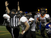 Washougal's team members cheer as they score a touchdown at a game in Ridgefield Friday September 29, 2016. Washougal squared off with Ridgefield.