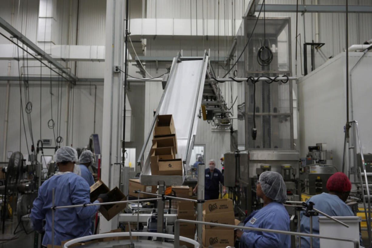 Workers prepare products for shipment Aug. 29 at Tulkoff Food Products in Baltimore. Aaron P.