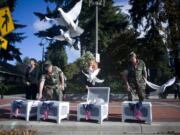 Jadia Ward, second from right, releases doves during the Patriot Day ceremony at Vancouver City Hall on Sept. 11, 2016. The ceremony was held in remembrance of the nearly 3,000 people who died in the terrorist attacks on Sept. 11, 2001.