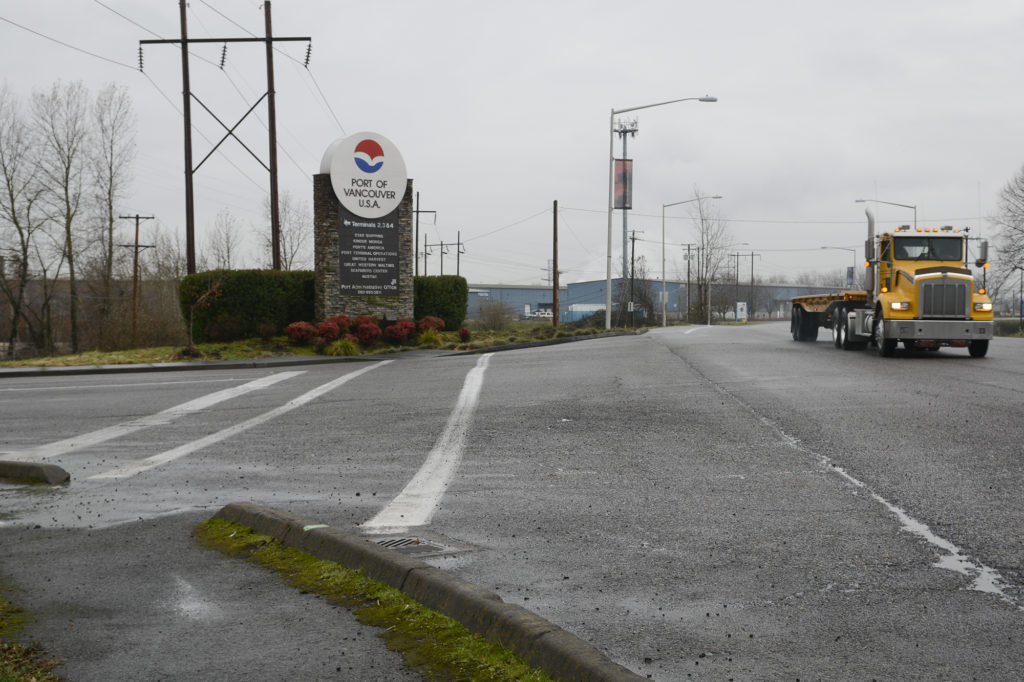 A truck passes the entrance to the Port of Vancouver.