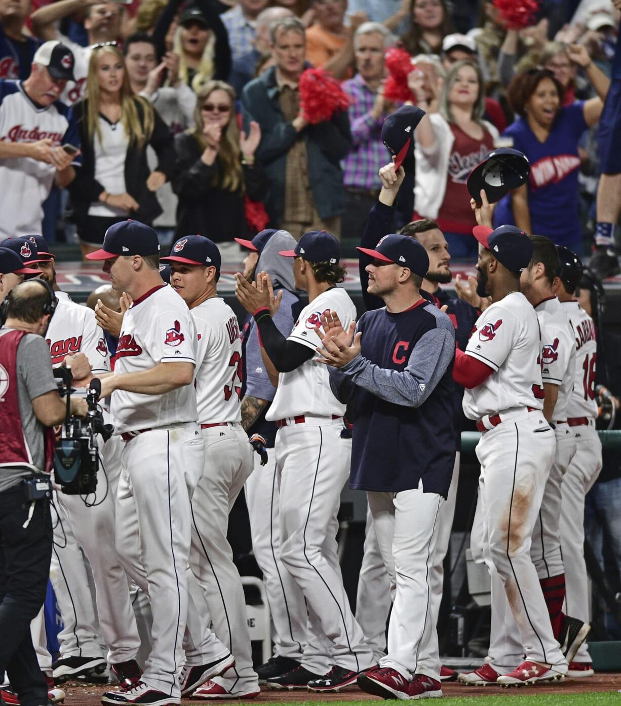 Cleveland Indians fans applaud the fans after the ninth inning of a baseball game against the Kansas City Royals, Friday, Sept. 15, 2017, in Cleveland.